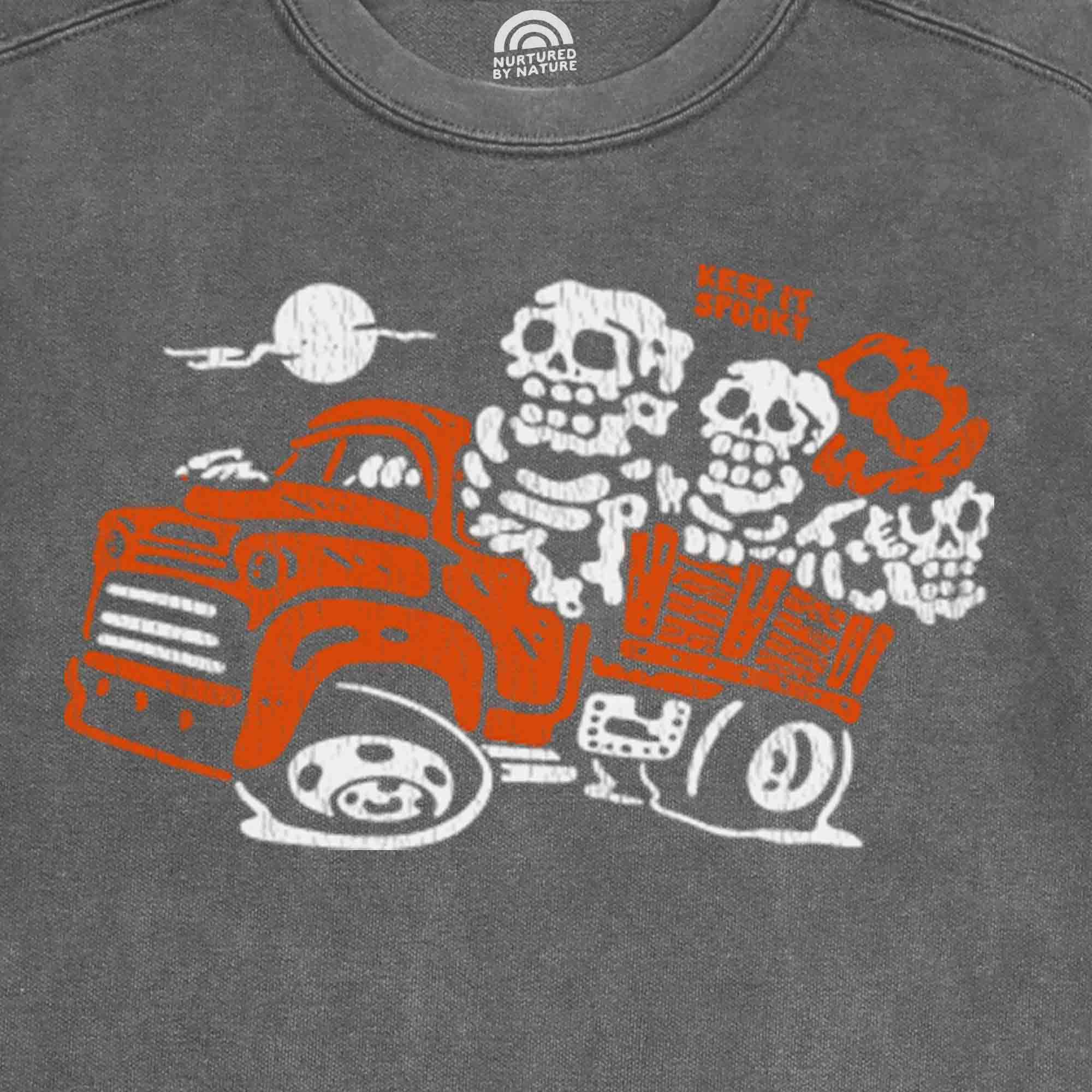 Spooky Haunted Hayride Graphic with Skeleton on a Truck on vintage wash grey crewneck sweatshirt made by Nurtured by Nature Studio