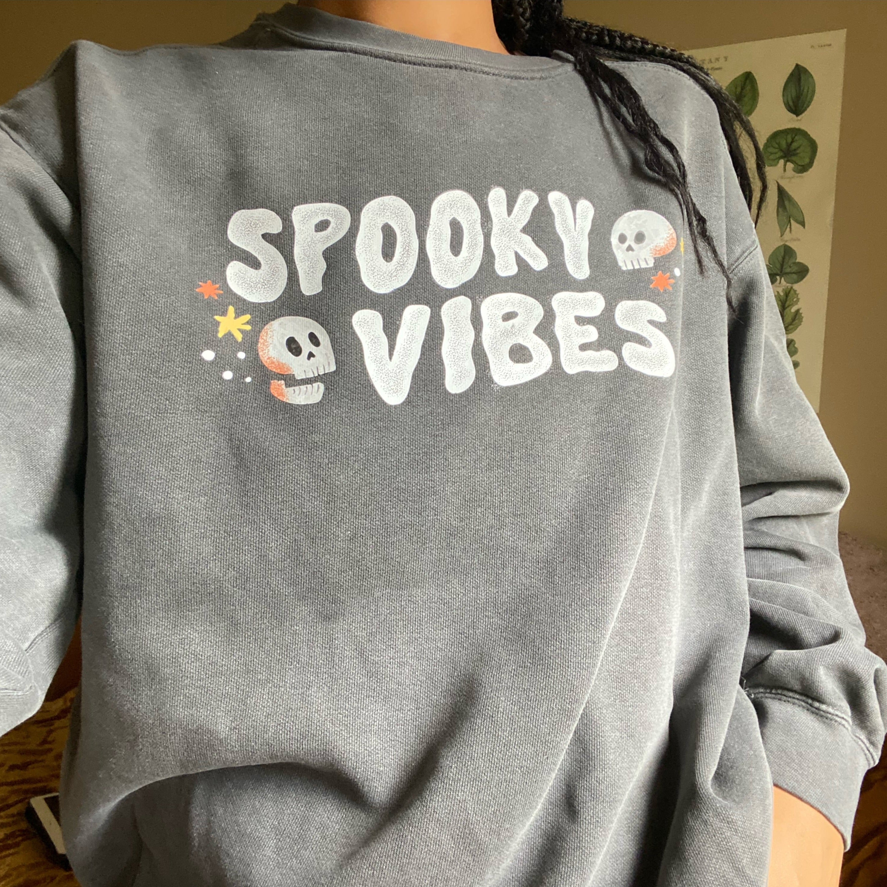 Spooky Vibes Halloween T-Shirt with Skulls on Garment Dyed Grey Crewneck Sweatshirt by Nurtured by Nature Studio